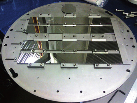 Fig.4-38 Photograph of the substrate holder (500 mmf?) of the IBS instrument installed in JAEA and the float glass substrates (50×400 mm) on it.