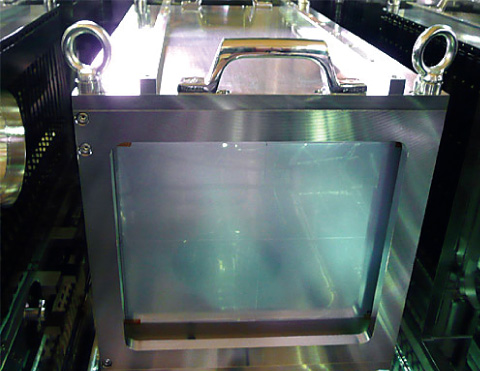 A container of 22 radiochromic dosimetry films for measuring the size and uniformity of a beam, installed in the chamber for formation and irradiation of a large-area uniform beam